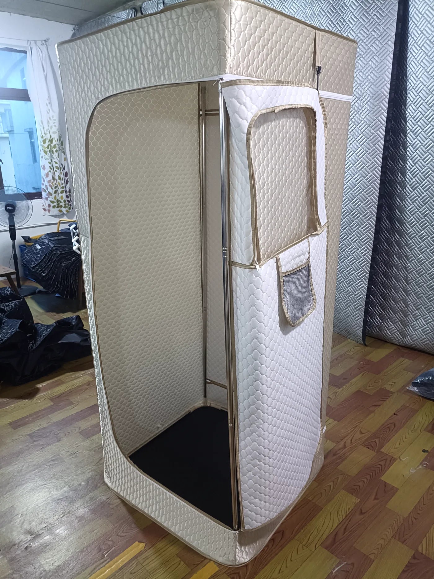 Portable sauna with the front door opened to show the interior